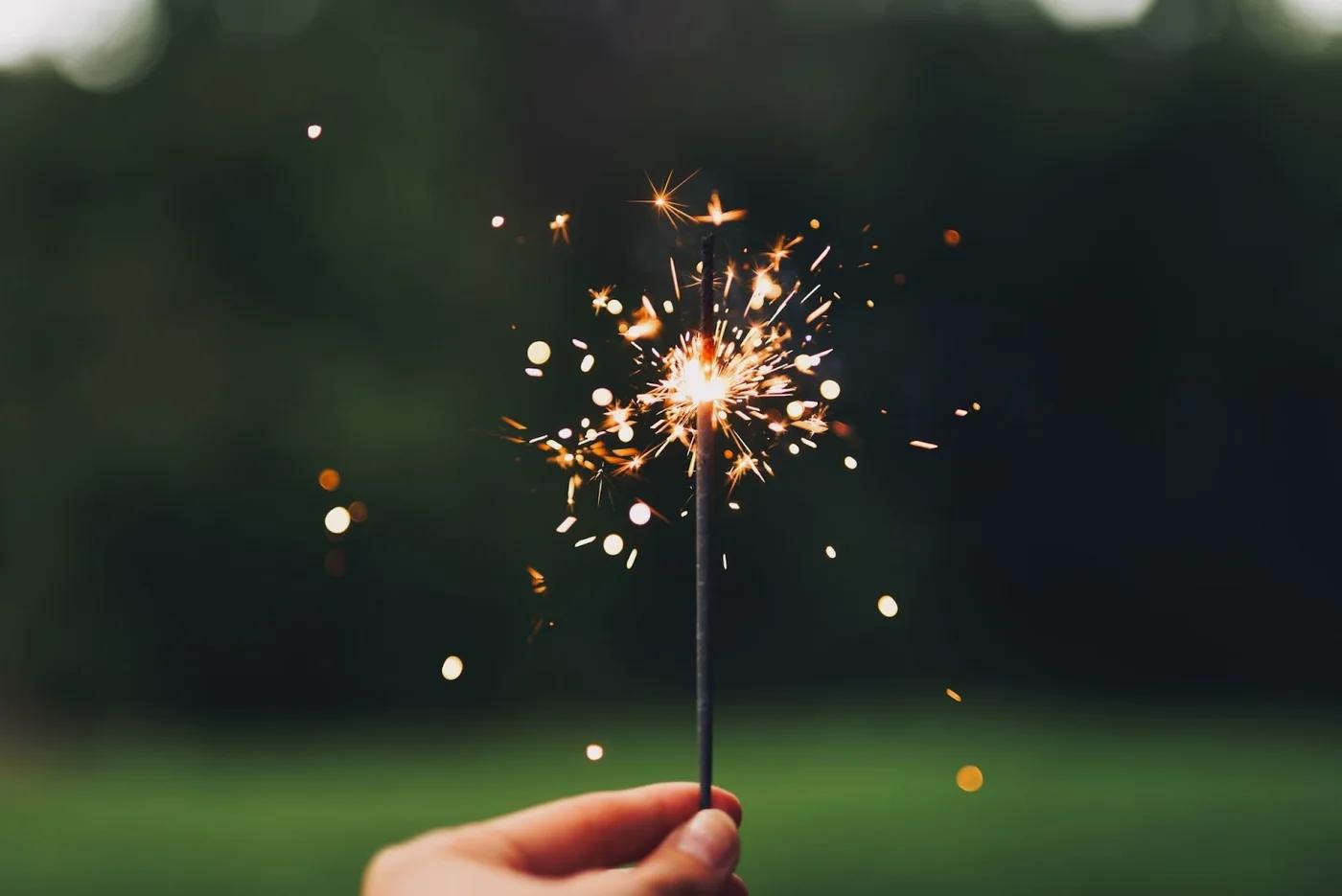 Hand holding a firecracker