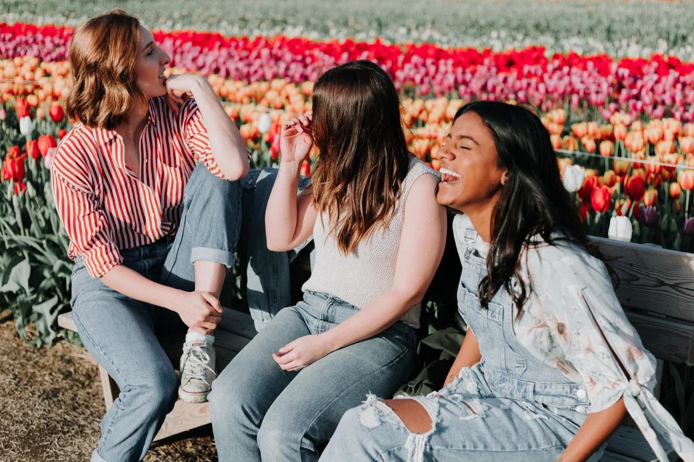Friends sharing a laugh in the park